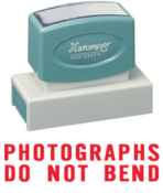 "PHOTOGRAPHS DO NOT BEND" large pre-inked Xstamper stock stamps with a 7/8" x 2-3/4" impression size. Oil-based Ink.  Free shipping! No sales tax!